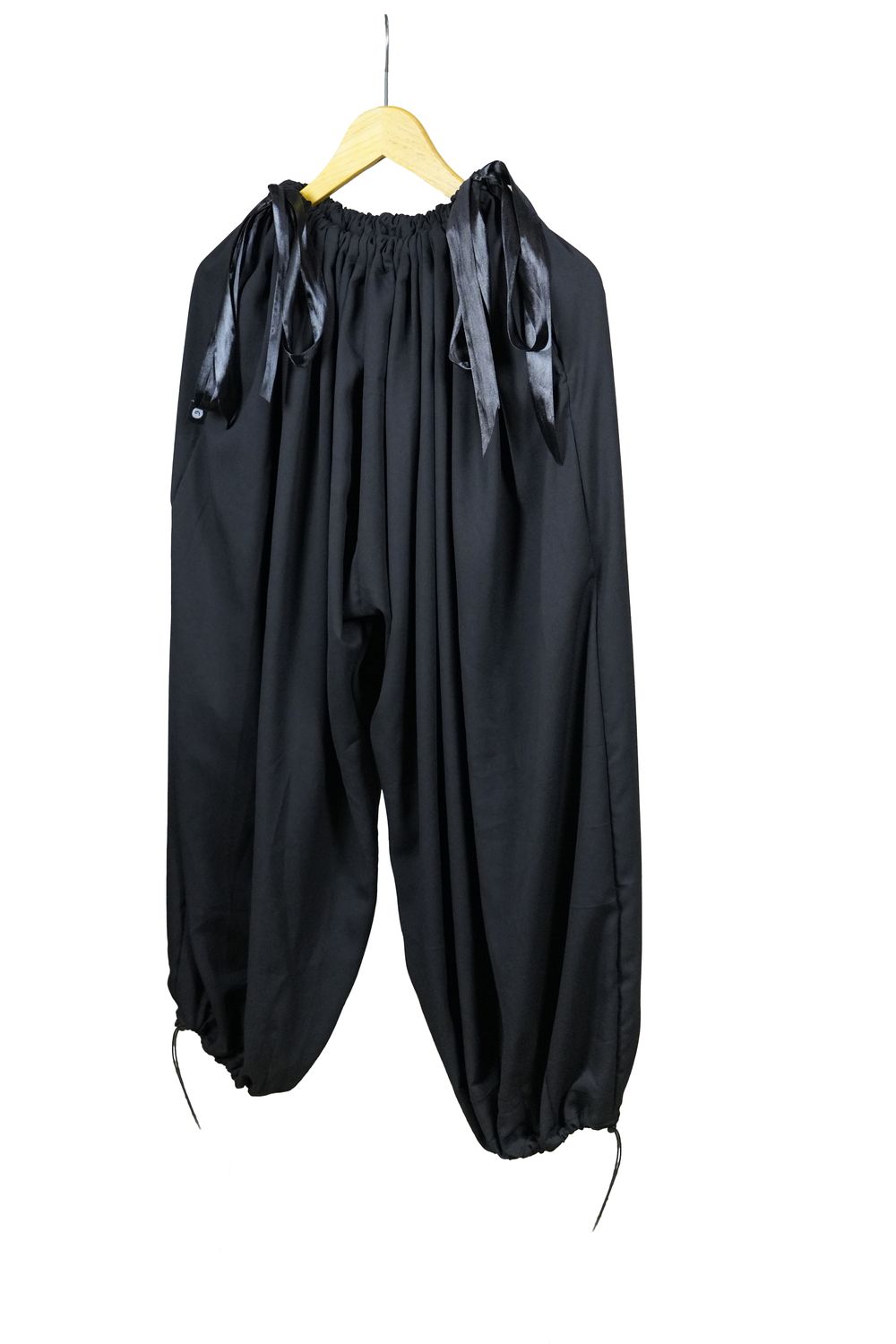 Balloon Trousers — front on a hanger