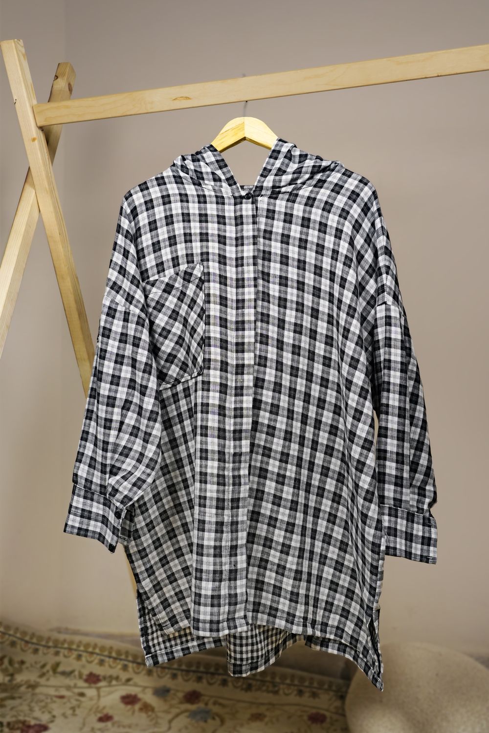Hooded Check Shirt — front on a hanger