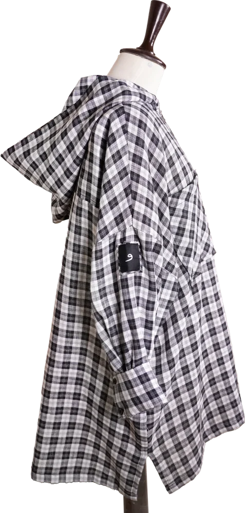 The Hooded Check Shirt on a dress form, side view with the و sleeve patch
