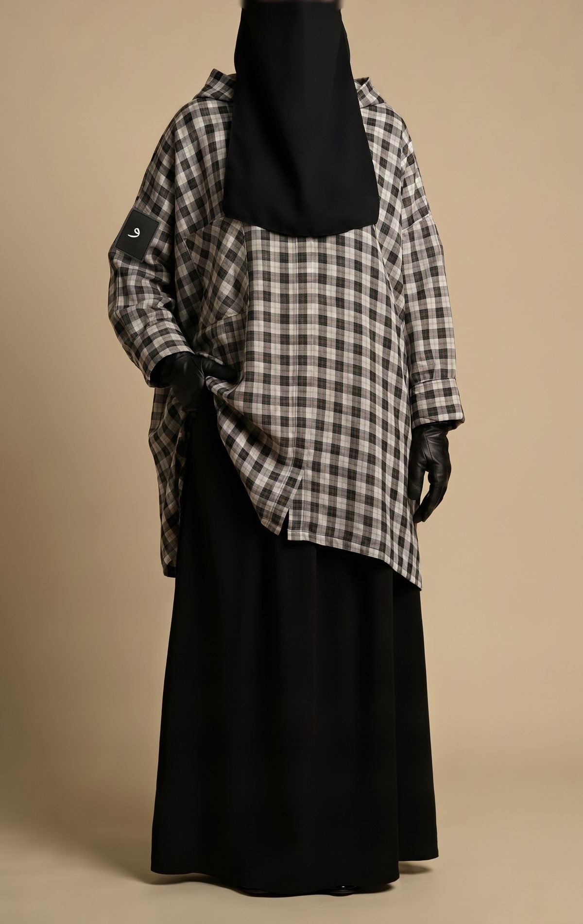 The Hooded Check Shirt worn over the black Maxi Skirt
